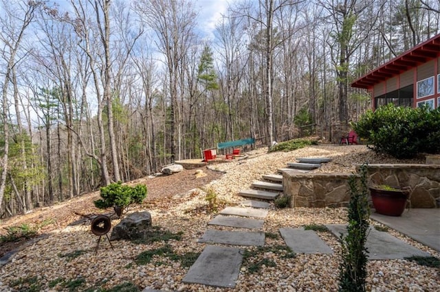 view of yard featuring a view of trees
