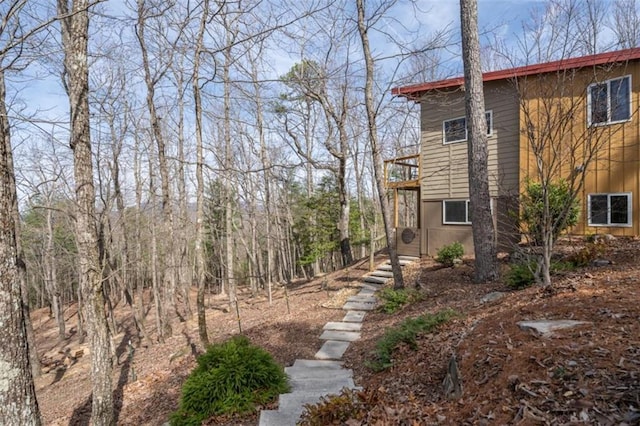 view of side of property featuring a balcony