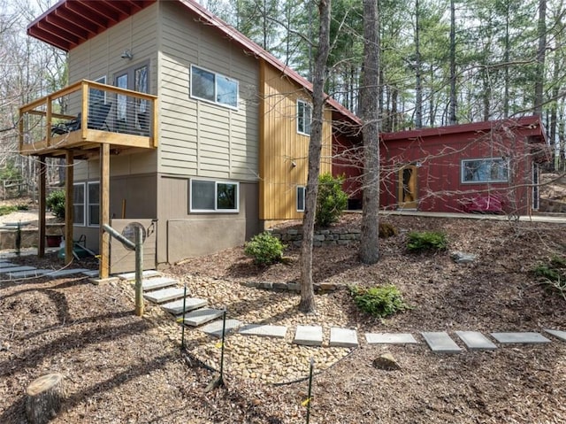 view of home's exterior featuring a balcony