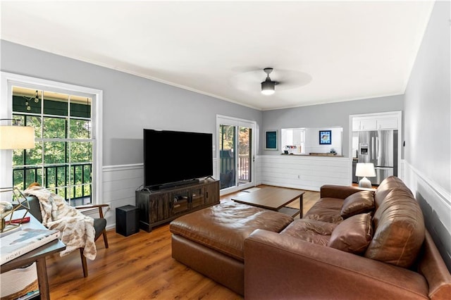 650 Crestview Ter, Gainesville, GA 30501 - living room featuring a ceiling fan, a wainscoted wall, crown molding, and wood finished floors
