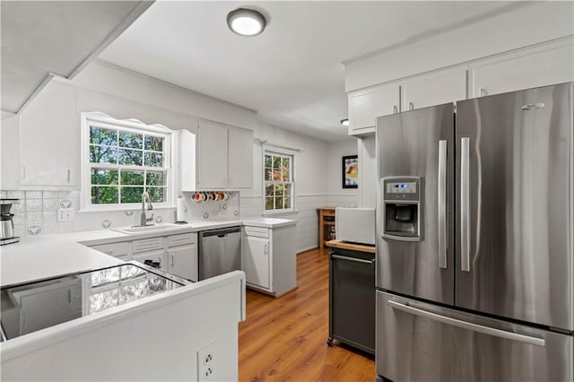 650 Crestview Ter, Gainesville, GA 30501 - kitchen with stainless steel appliances, white cabinetry, light wood-style floors, and light countertops