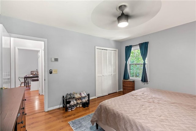 650 Crestview Ter, Gainesville, GA 30501 - bedroom with light wood-type flooring, a closet, and a ceiling fan
