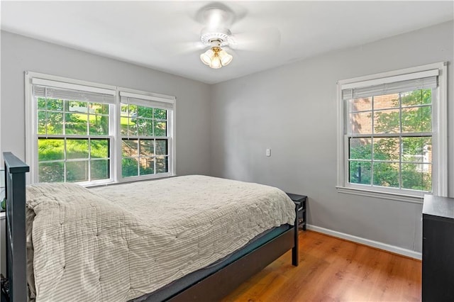 650 Crestview Ter, Gainesville, GA 30501 - bedroom featuring wood finished floors and multiple windows
