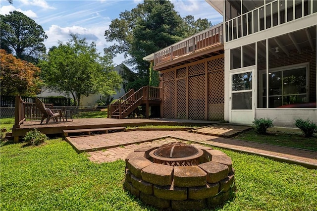 650 Crestview Ter, Gainesville, GA 30501 - view of green lawn with an outdoor fire pit, a deck, a patio, and stairs