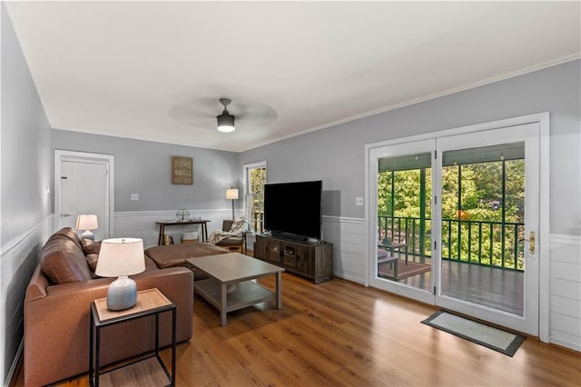 650 Crestview Ter, Gainesville, GA 30501 - living area with wainscoting, wood finished floors, plenty of natural light, ceiling fan, and ornamental molding