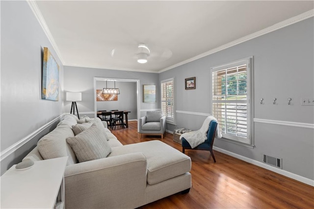 650 Crestview Ter, Gainesville, GA 30501 - living area featuring ornamental molding, wood finished floors, and a chandelier