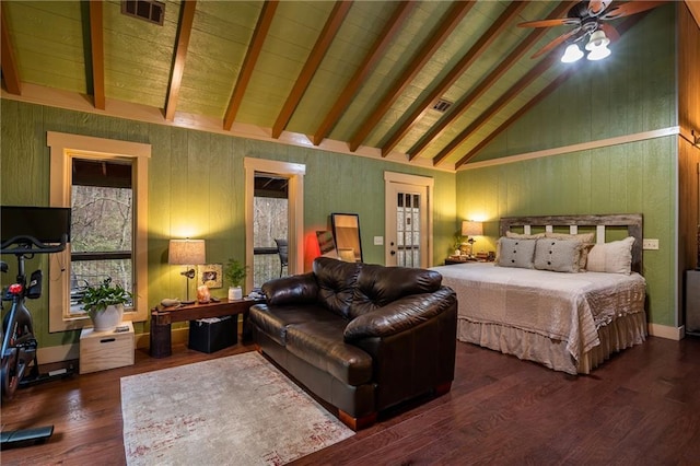 bedroom with visible vents, high vaulted ceiling, wood finished floors, and beam ceiling