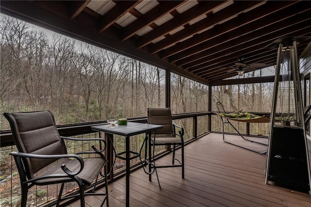 wooden deck featuring a ceiling fan