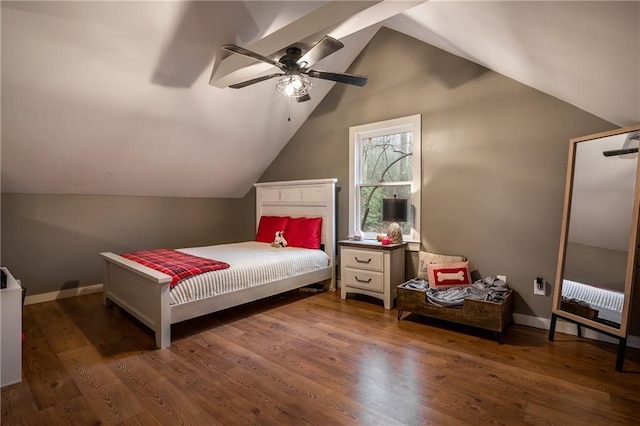 bedroom featuring lofted ceiling, ceiling fan, baseboards, and wood finished floors