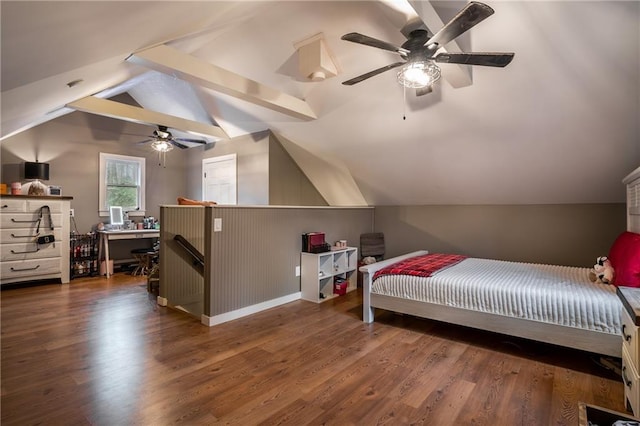 bedroom featuring lofted ceiling with beams, wood finished floors, a ceiling fan, and baseboards