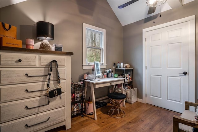 home office featuring lofted ceiling, ceiling fan, and wood finished floors