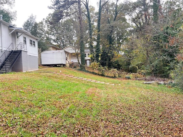 view of yard featuring stairway