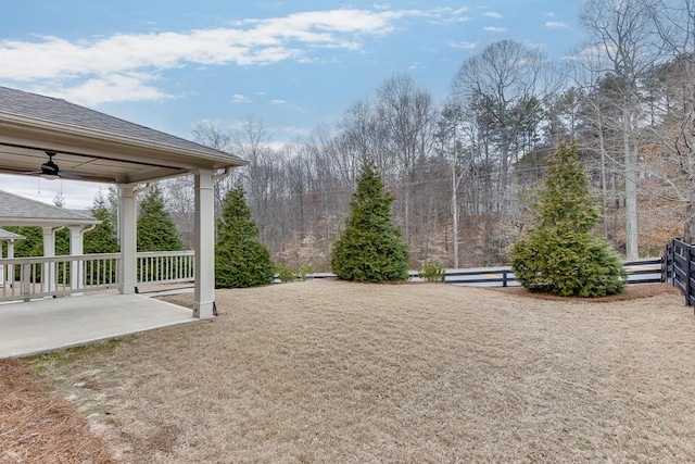 view of yard with a ceiling fan