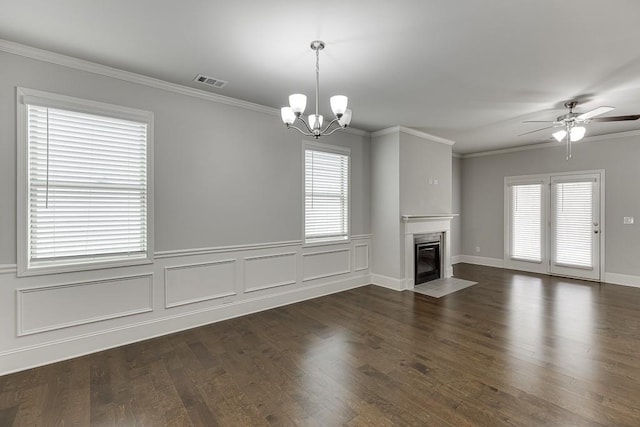 unfurnished living room featuring a fireplace with flush hearth, a wealth of natural light, visible vents, and ornamental molding