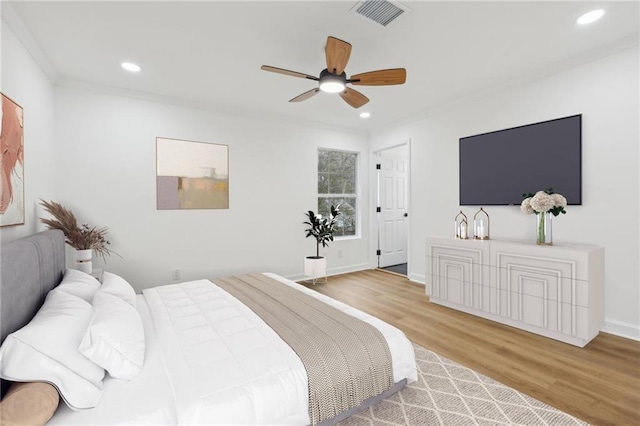 bedroom featuring ceiling fan and light hardwood / wood-style floors