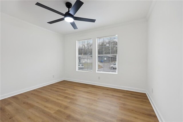 bathroom featuring vanity, ornamental molding, walk in shower, and toilet