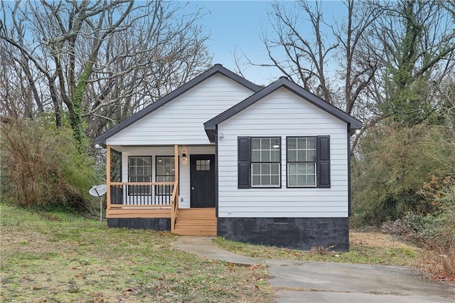 bungalow-style home with a porch and a front yard