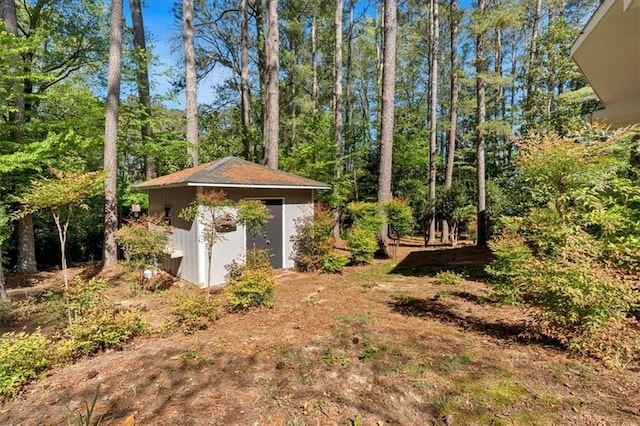 view of yard with a shed and an outbuilding