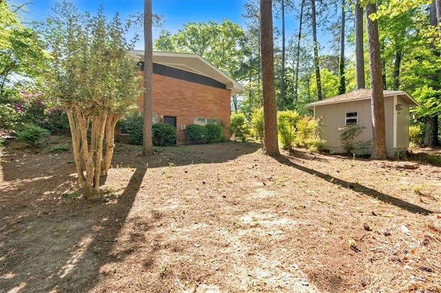 view of side of property with an outbuilding