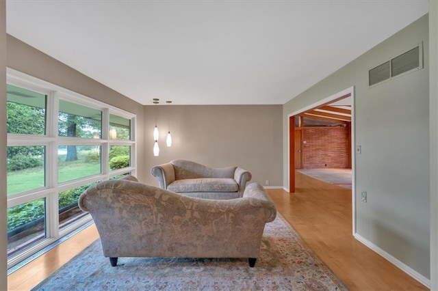 living room with light wood finished floors and baseboards