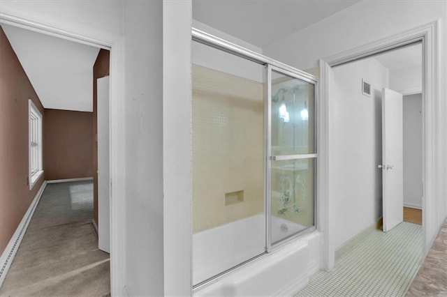 full bath featuring bath / shower combo with glass door and baseboards