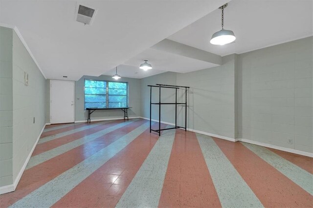 unfurnished room featuring baseboards