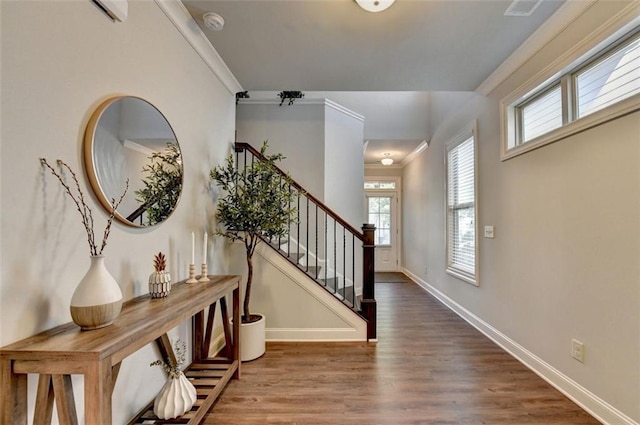 4335 Bellview Ln, Duluth, GA 30097 - entrance foyer featuring healthy amount of natural light, wood finished floors, stairs, and crown molding