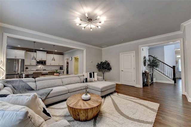 4335 Bellview Ln, Duluth, GA 30097 - living room featuring dark wood-type flooring, stairway, a chandelier, crown molding, and recessed lighting