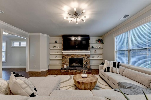 4335 Bellview Ln, Duluth, GA 30097 - living room with dark wood-style floors, crown molding, a stone fireplace, and a chandelier
