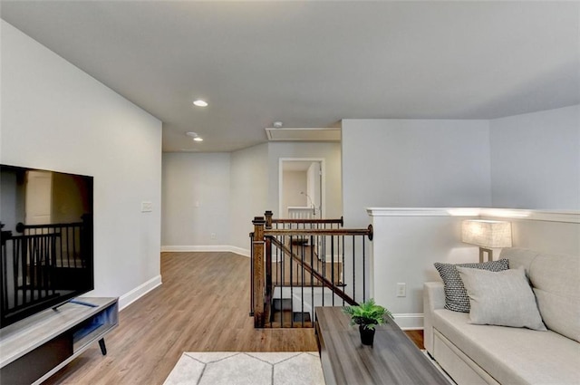 4335 Bellview Ln, Duluth, GA 30097 - sitting room with an upstairs landing, wood finished floors, and recessed lighting