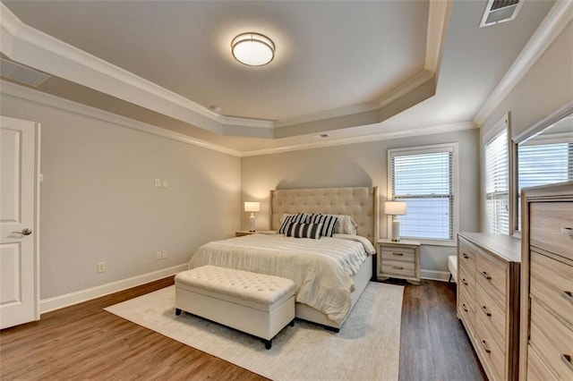 4335 Bellview Ln, Duluth, GA 30097 - bedroom with a tray ceiling, crown molding, and wood finished floors