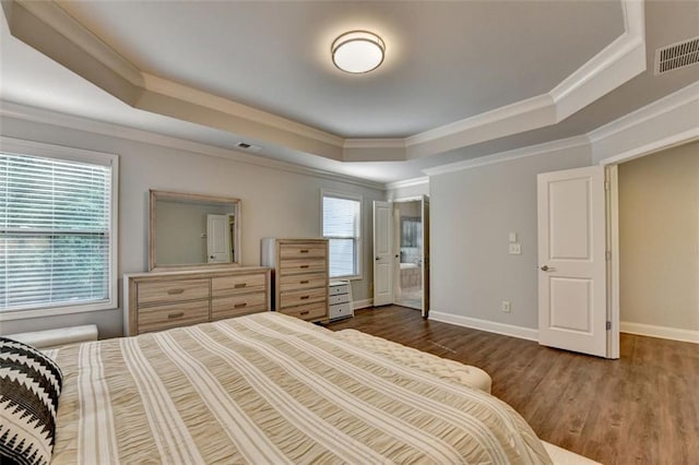 4335 Bellview Ln, Duluth, GA 30097 - bedroom featuring a tray ceiling, wood finished floors, and crown molding