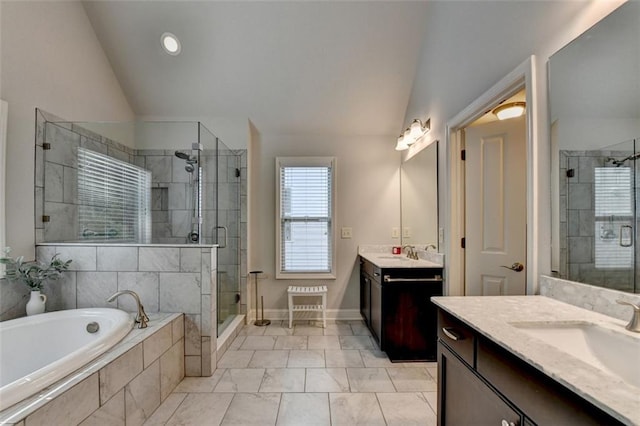 4335 Bellview Ln, Duluth, GA 30097 - bathroom with two vanities, vaulted ceiling, a stall shower, a garden tub, and recessed lighting