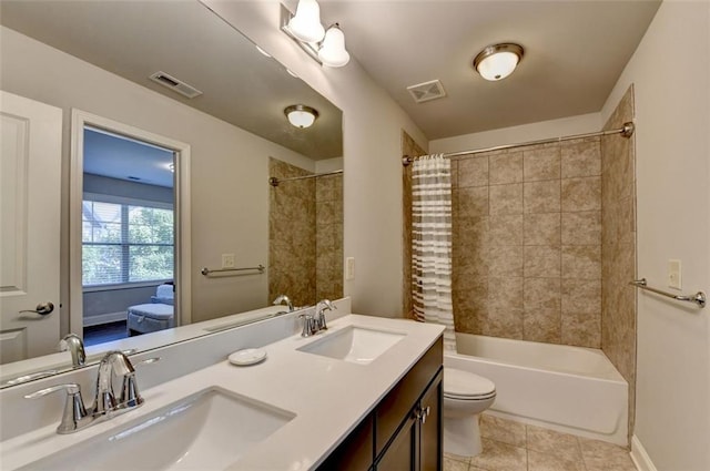 4335 Bellview Ln, Duluth, GA 30097 - bathroom featuring double vanity, shower / bath combo with shower curtain, and tile patterned floors