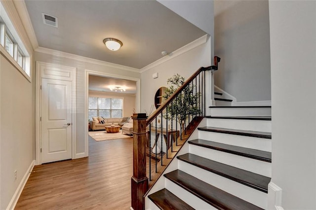 4335 Bellview Ln, Duluth, GA 30097 - foyer with crown molding, wood finished floors, and stairway