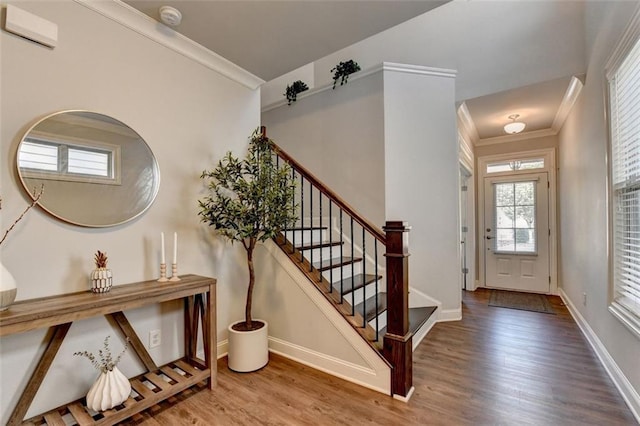 4335 Bellview Ln, Duluth, GA 30097 - foyer entrance featuring wood finished floors, plenty of natural light, stairs, and ornamental molding