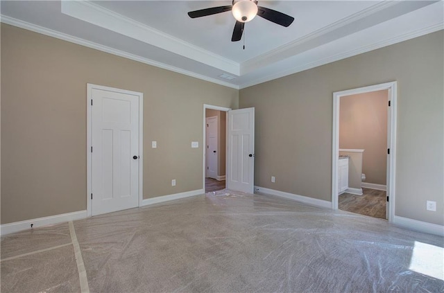 311 Arbor Cir, Rockmart, GA 30153 - unfurnished bedroom with carpet flooring, a raised ceiling, crown molding, connected bathroom, and a ceiling fan