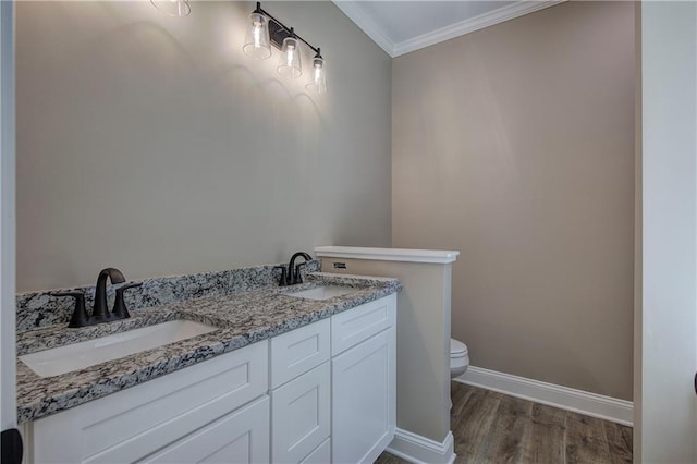 311 Arbor Cir, Rockmart, GA 30153 - bathroom with wood finished floors, crown molding, and double vanity