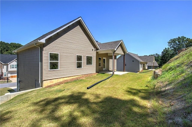 311 Arbor Cir, Rockmart, GA 30153 - back of property featuring a yard and a patio area