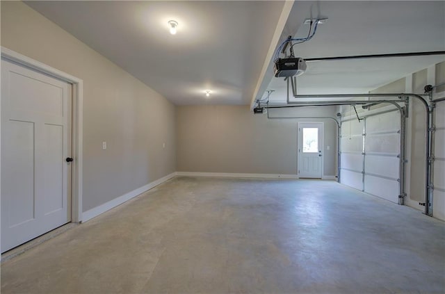 311 Arbor Cir, Rockmart, GA 30153 - garage featuring a garage door opener and baseboards
