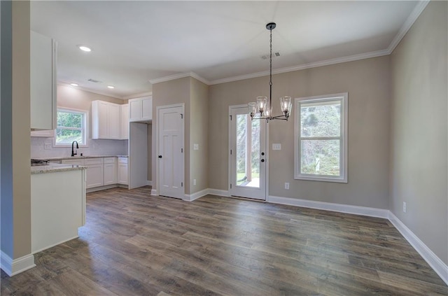 311 Arbor Cir, Rockmart, GA 30153 - kitchen featuring white cabinetry, a chandelier, dark wood finished floors, pendant lighting, and decorative backsplash