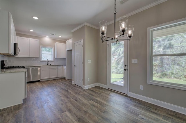 311 Arbor Cir, Rockmart, GA 30153 - kitchen with appliances with stainless steel finishes, ornamental molding, a chandelier, dark wood finished floors, and white cabinetry