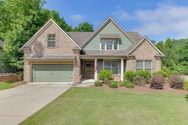6206 Little Cove Dr, Flowery Branch, GA 30542 - craftsman-style home with brick siding, a front yard, concrete driveway, a garage, and a shingled roof