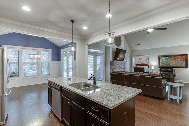 6206 Little Cove Dr, Flowery Branch, GA 30542 - kitchen with stainless steel appliances, vaulted ceiling, dark wood-style floors, dark brown cabinetry, and light stone countertops