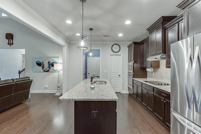 6206 Little Cove Dr, Flowery Branch, GA 30542 - kitchen with stainless steel appliances, ornamental molding, under cabinet range hood, dark brown cabinetry, and tasteful backsplash
