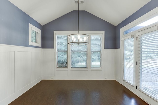 6206 Little Cove Dr, Flowery Branch, GA 30542 - unfurnished dining area with a decorative wall, dark wood finished floors, a chandelier, a wainscoted wall, and vaulted ceiling