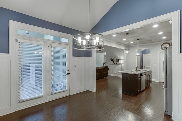 6206 Little Cove Dr, Flowery Branch, GA 30542 - kitchen with dark brown cabinetry, a chandelier, a decorative wall, dark wood-style floors, and lofted ceiling