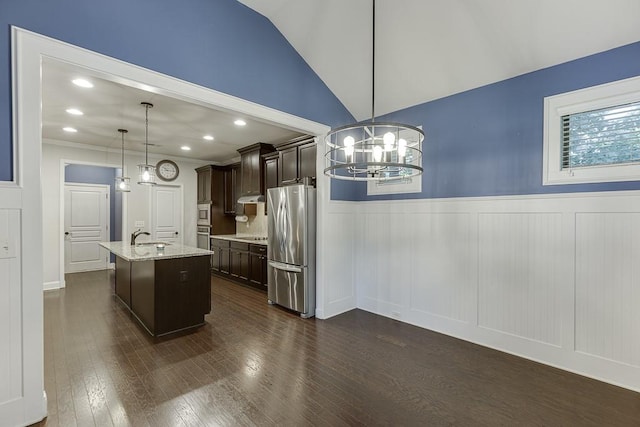 6206 Little Cove Dr, Flowery Branch, GA 30542 - kitchen with freestanding refrigerator, dark brown cabinetry, a chandelier, light stone countertops, and dark wood-style floors