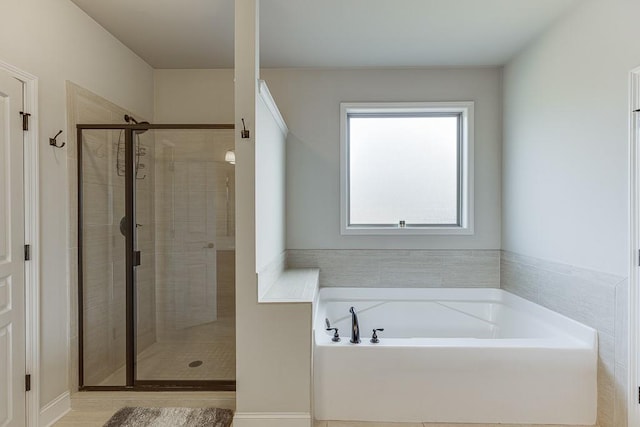 6206 Little Cove Dr, Flowery Branch, GA 30542 - bathroom featuring a garden tub and a stall shower