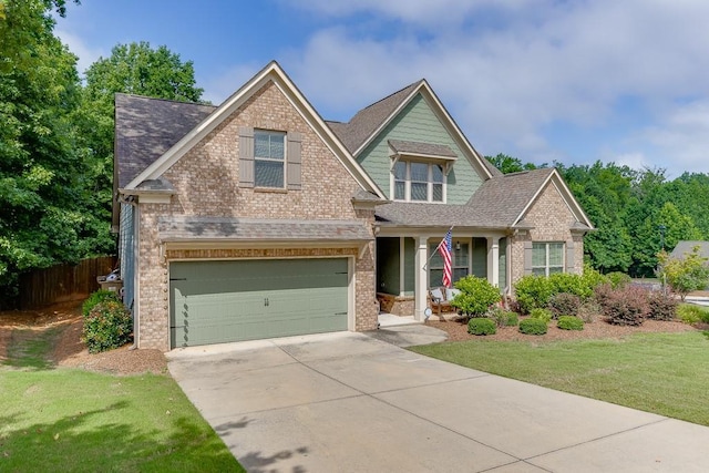 6206 Little Cove Dr, Flowery Branch, GA 30542 - craftsman inspired home with brick siding, concrete driveway, an attached garage, a porch, and a shingled roof